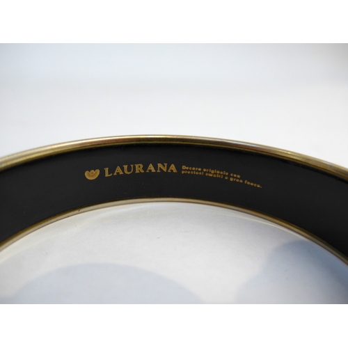 7331 - A Laurana Italian enamel bangle in black ground with bronze, silver and gold coloured design, circa ... 