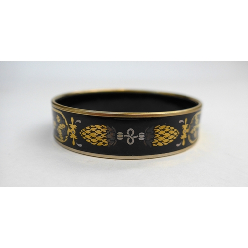 7331 - A Laurana Italian enamel bangle in black ground with bronze, silver and gold coloured design, circa ... 