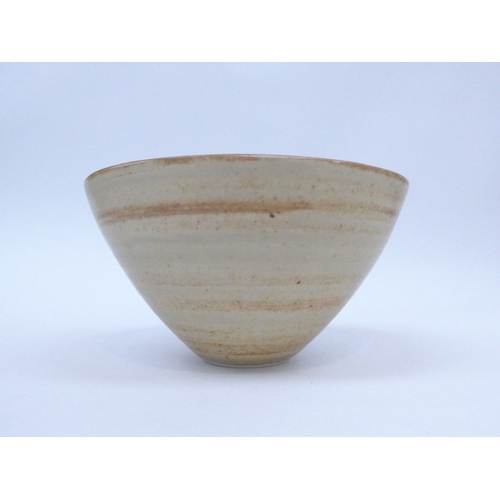 7159 - JOANNA CONSTANTINIDIS (1927-2000): A Studio porcelain bowl of flared form.  Banded oatmeal glaze. Im... 