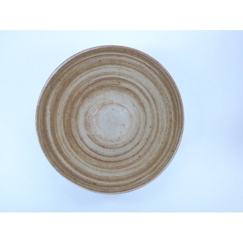 7159 - JOANNA CONSTANTINIDIS (1927-2000): A Studio porcelain bowl of flared form.  Banded oatmeal glaze. Im... 