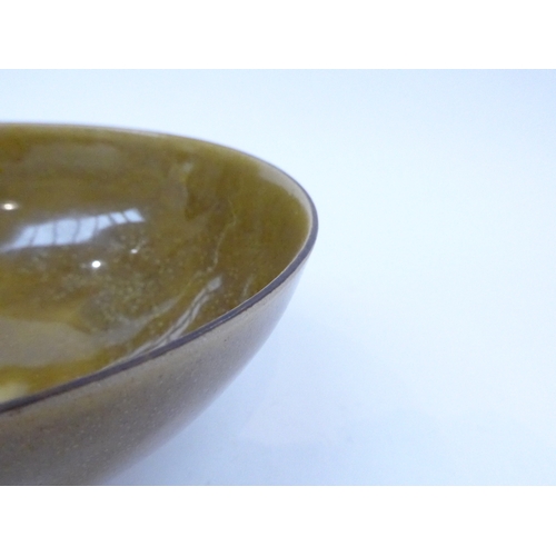 7160 - DAME LUCIE RIE (1902-1995) (ARR) A Studio stoneware bowl with olive green glaze, manganese rim.  Imp... 