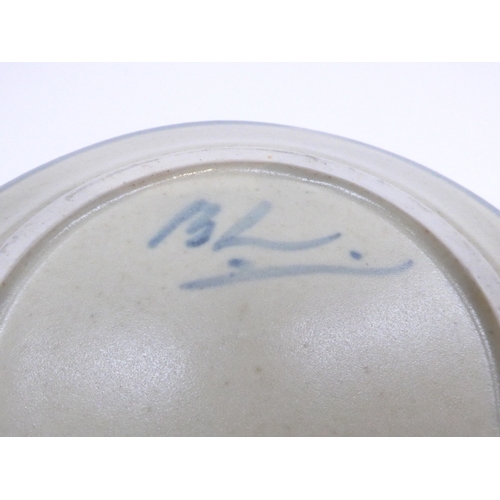 7118 - BERNARD LEACH (1887-1979): A St Ives pottery side plate, with painted blue dash decoration.  Painted... 