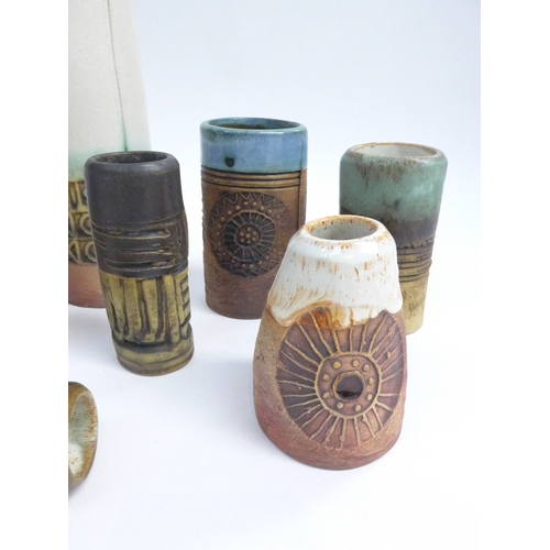 7092 - A collection of eight Bob Dawe Pottery cylindrical vases, various styles with relief moulded pattern... 