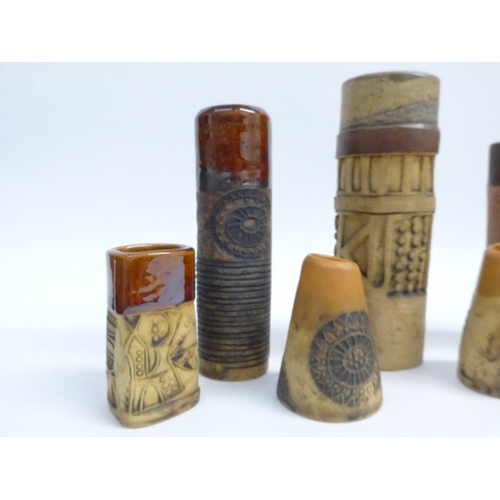 7096 - A collection of seven Bob Dawe Pottery cylindrical vases, various styles with relief moulded pattern... 