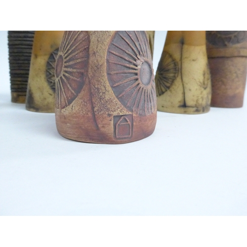 7096 - A collection of seven Bob Dawe Pottery cylindrical vases, various styles with relief moulded pattern... 