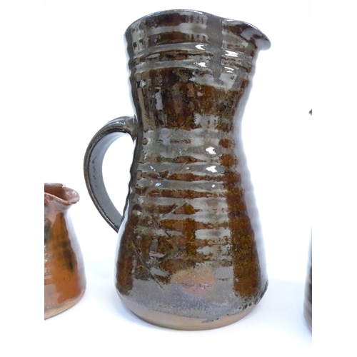 7051 - St Ives Leach Pottery - Four various jugs with tenmoku and similar glazes. Impressed Pottery seals o... 