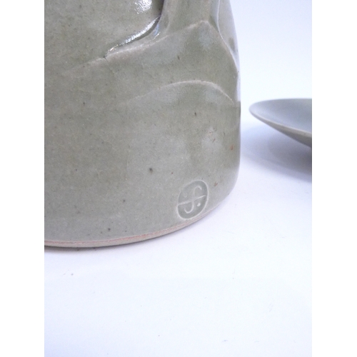 7059 - St Ives Leach Pottery - A green glazed stoneware wine ewer and stopper, 22cm high, together with fiv... 