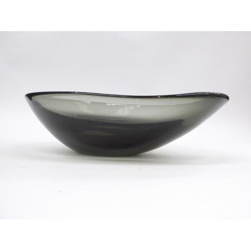 7270 - A smoked glass freeform shallow bowl, possibly Scandinavian. 29cm x 21cm x 8cm high