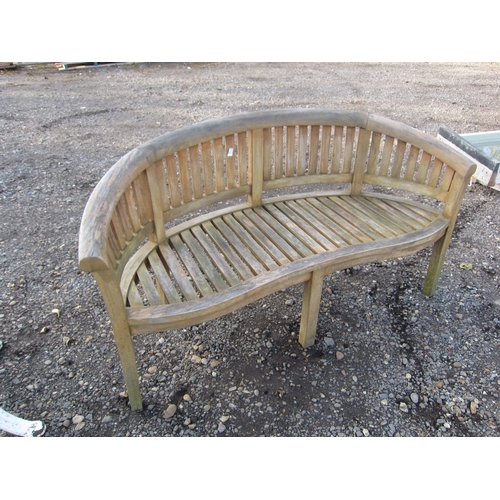 3464 - A teak curved garden bench