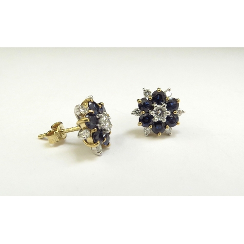 9009 - A pair of 18ct gold sapphire and diamond cluster earrings 13mm diameter, 5.5g, in original box