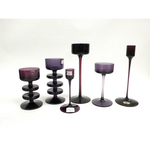 7274 - A collection of Wedgwood amethyst candlesticks by Ronald Sennett-Willson. Three and Two ring Shering... 