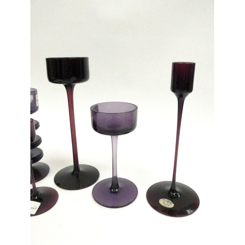 7274 - A collection of Wedgwood amethyst candlesticks by Ronald Sennett-Willson. Three and Two ring Shering... 