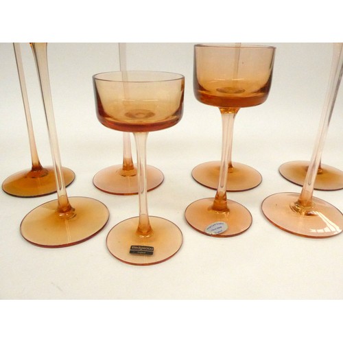 7273 - Eight Wedgwood Brancaster candlesticks by Ronald Stennett-Willson in amber/ topaz. Tallest 15.5cm