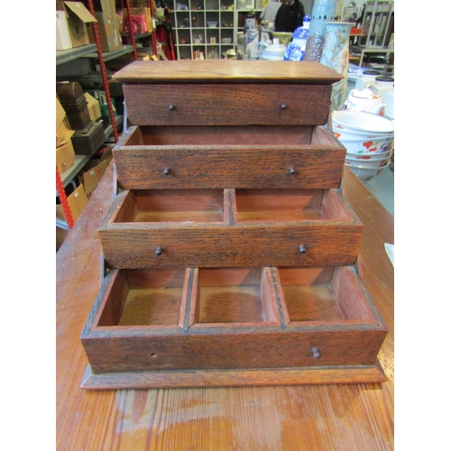 1001 - A small cantilever oak box with lid to top, 19.5cm tall