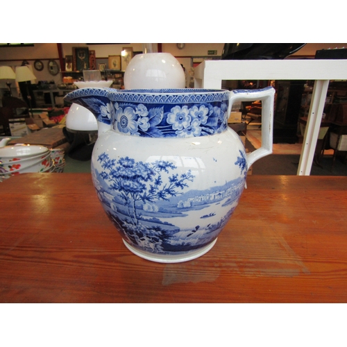 1003 - A 19th Century large blue and white jug with external figural scenes, chip to beak, 22cm tall