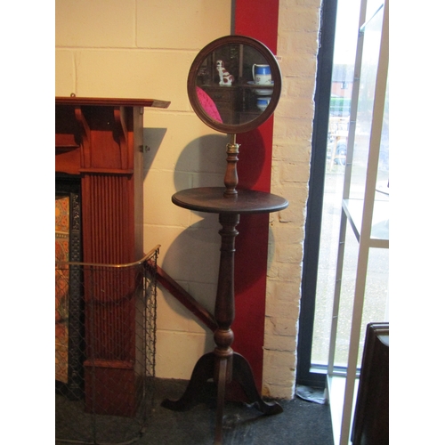 1006 - A gent's shaving mirror with turned column on tripod feet, approximately 140cm tall