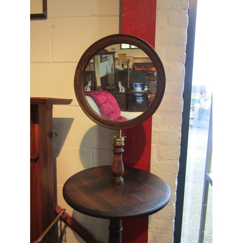 1006 - A gent's shaving mirror with turned column on tripod feet, approximately 140cm tall