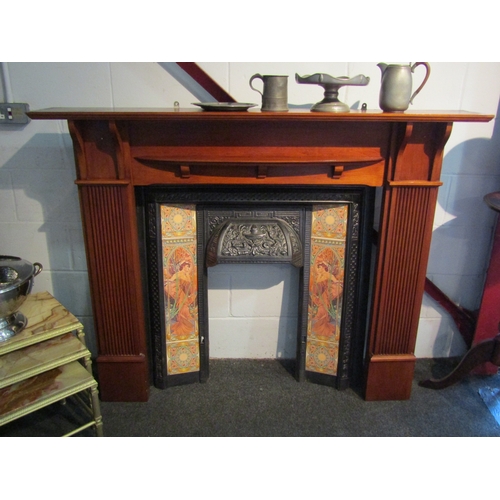 1009 - A fire place with a cast iron and tiled Art Nouveau influence surround, fire place 118cm tall x 150c... 