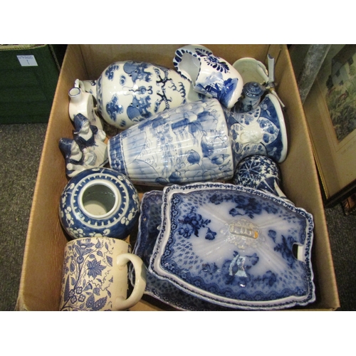 1077 - A box of blue and white ceramics including twin handled cup, vases, serving dish, ginger jar etc.