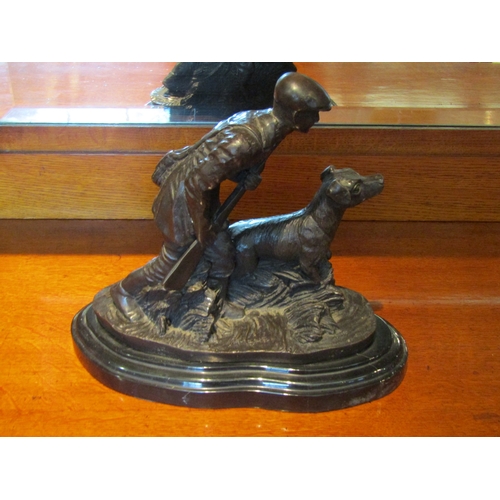 1082 - A hollow cast bronze study of a hunter with a shotgun and retriever after Pierre Jules Mene raised o... 