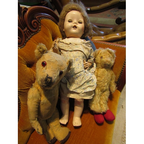 1091 - Two care worn articulated teddy bears, a hard plastic walking doll and a Noddy soft toy (4)