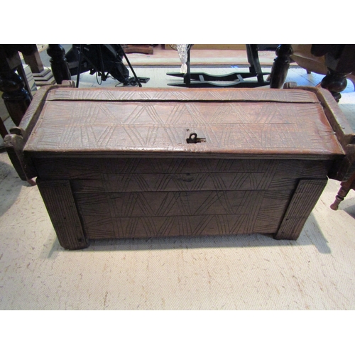 1098 - An early 19th Century Eastern oak chest with arch top and lockable lid, 51cm tall x 94cm long x 54cm... 