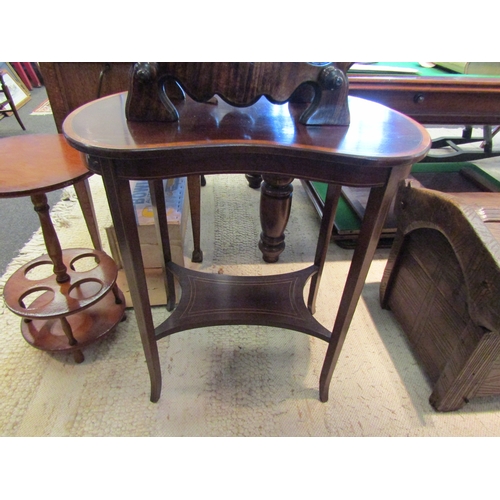 1100 - An Edwardian mahogany kidney-shaped table with under-tier shelf on outswept feet a/f, 72cm tall x 65... 