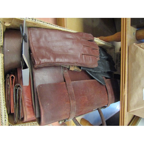 1125 - A box of leather goods including wallets, satchels, gloves and belt