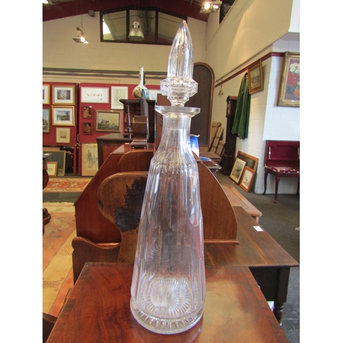 1127 - A large clear cut-glass chemist's shop window decanter, 52cm tall