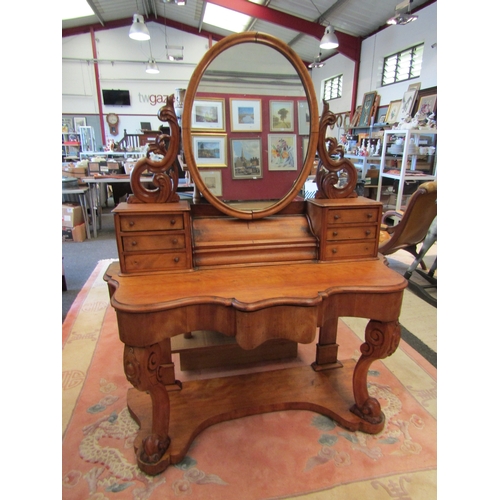 1128 - A late Victorian satinwood Duchess dressing table, central lift-up compartment flanked by six small ... 