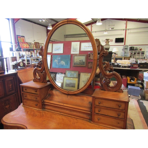 1128 - A late Victorian satinwood Duchess dressing table, central lift-up compartment flanked by six small ... 