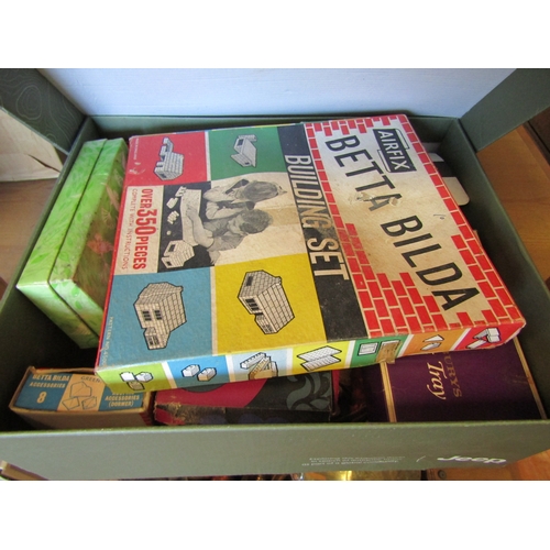 1133 - A box of building blocks and a Monopoly board with accessories