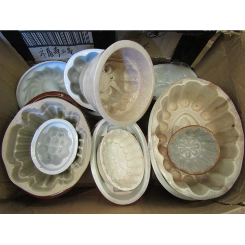 1138 - A box containing a quantity of ceramic and pottery jelly moulds