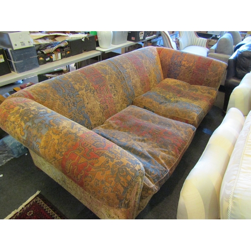 1188 - A Victorian style three seater Chesterfield sofa with scroll arms and duck-feather filled cushions