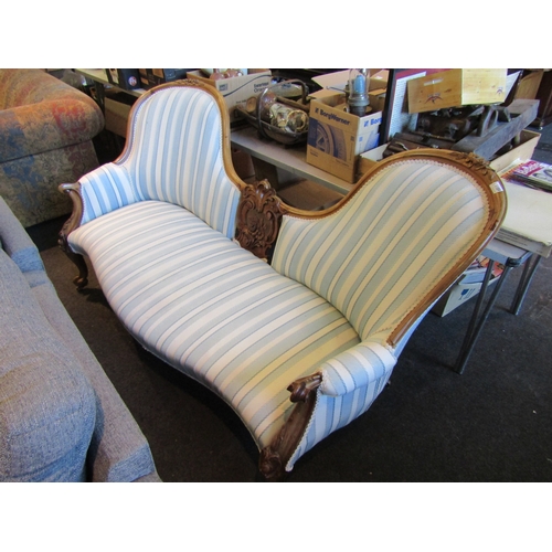 1189 - A mid-19th Century French walnut sofa with carved floral design backrest, cabriole fore legs on cast... 