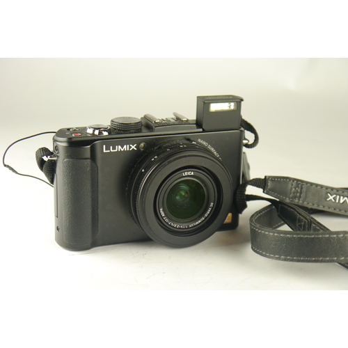 6029 - A Panasonic Lumix DMC-LX7 10.1 MP Digital Camera w/ a Panasonic DE-A82 battery charger