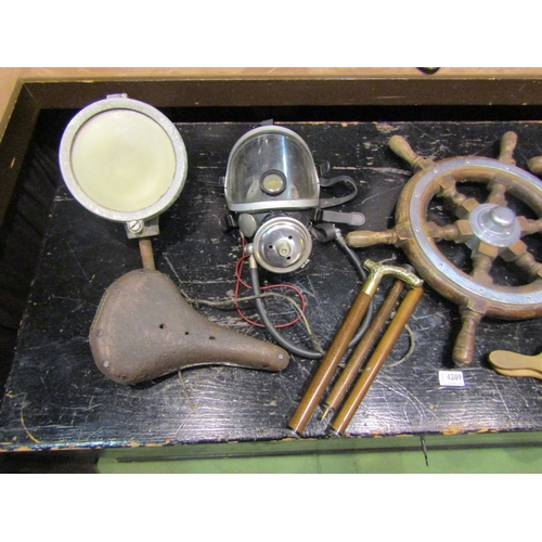 4246 - A box of miscellaneous including a brass propeller, ships wheel, two bicycle seats, walking sticks, ... 