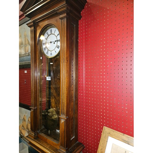 4035 - A late 19th Century walnut cased Vienna regulator wall clock with two train movement striking on a c... 