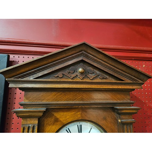 4035 - A late 19th Century walnut cased Vienna regulator wall clock with two train movement striking on a c... 