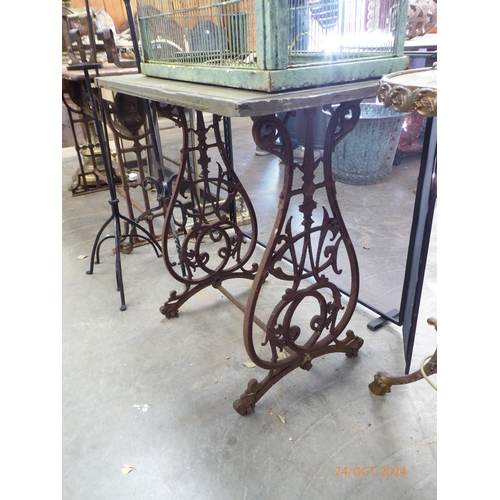 2027 - An iron garden table, marble top