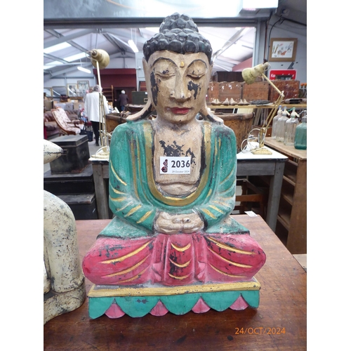 2036 - A multi coloured figure of a seated Buddha