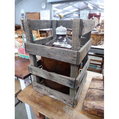 2038 - A brown carboy in crate