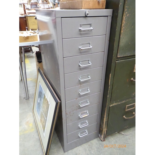 2054 - A nine drawer metal filing cabinet