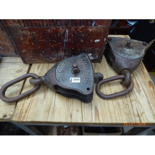 2065 - A pair of iron 'Wellin & Co' pulley blocks