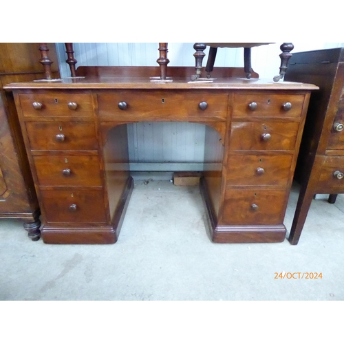 2114 - A 19th Century mahogany nine drawer desk by gillows (stamped in drawer)