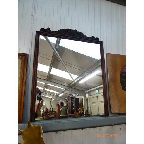 2120 - An early 19th Century rosewood framed mirror with carved crest