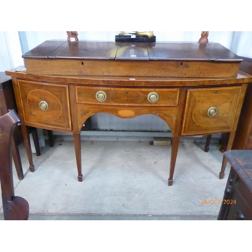 2125 - A Georgian mahogany and satinwood cross-banded bow fronted side board with three drawers, 186cm wide