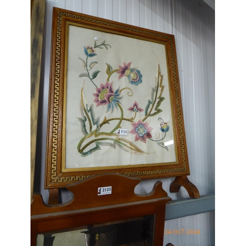 2132 - A mahogany wine table and embroidered fire screen