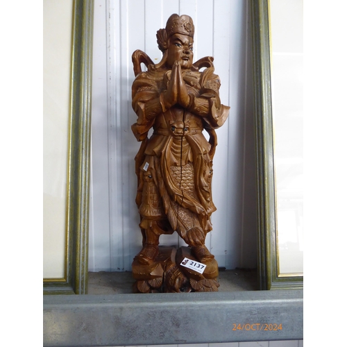 2137 - A carved wood deity