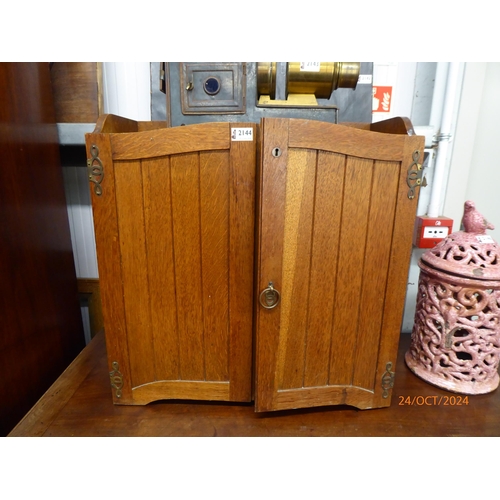 2144 - An Edwardian oak 2 door wall cupboard